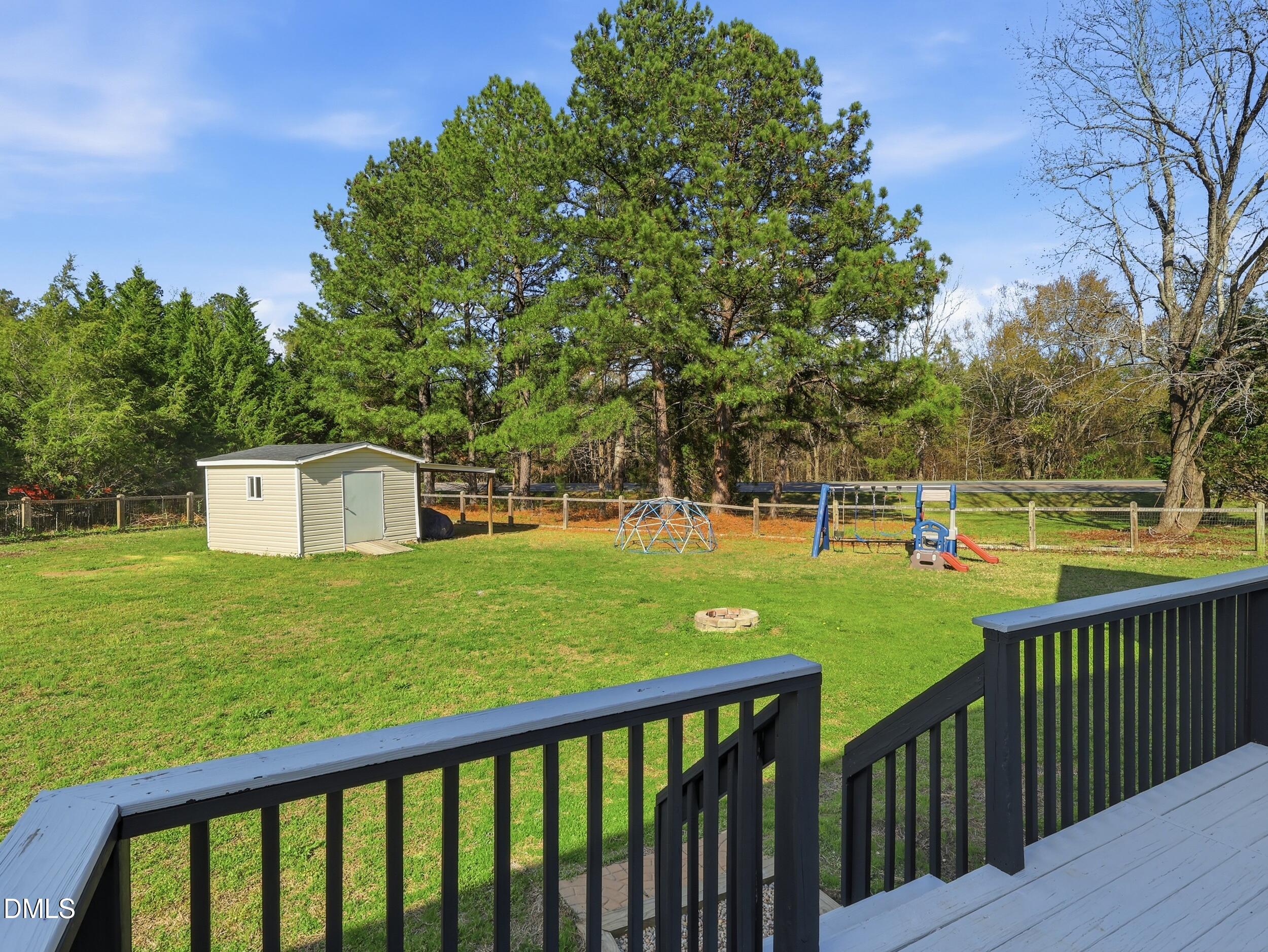 10 Kinderkamack Road Youngsville, NC 27596 - Photo 26 of 46 a view of a garden and deck
