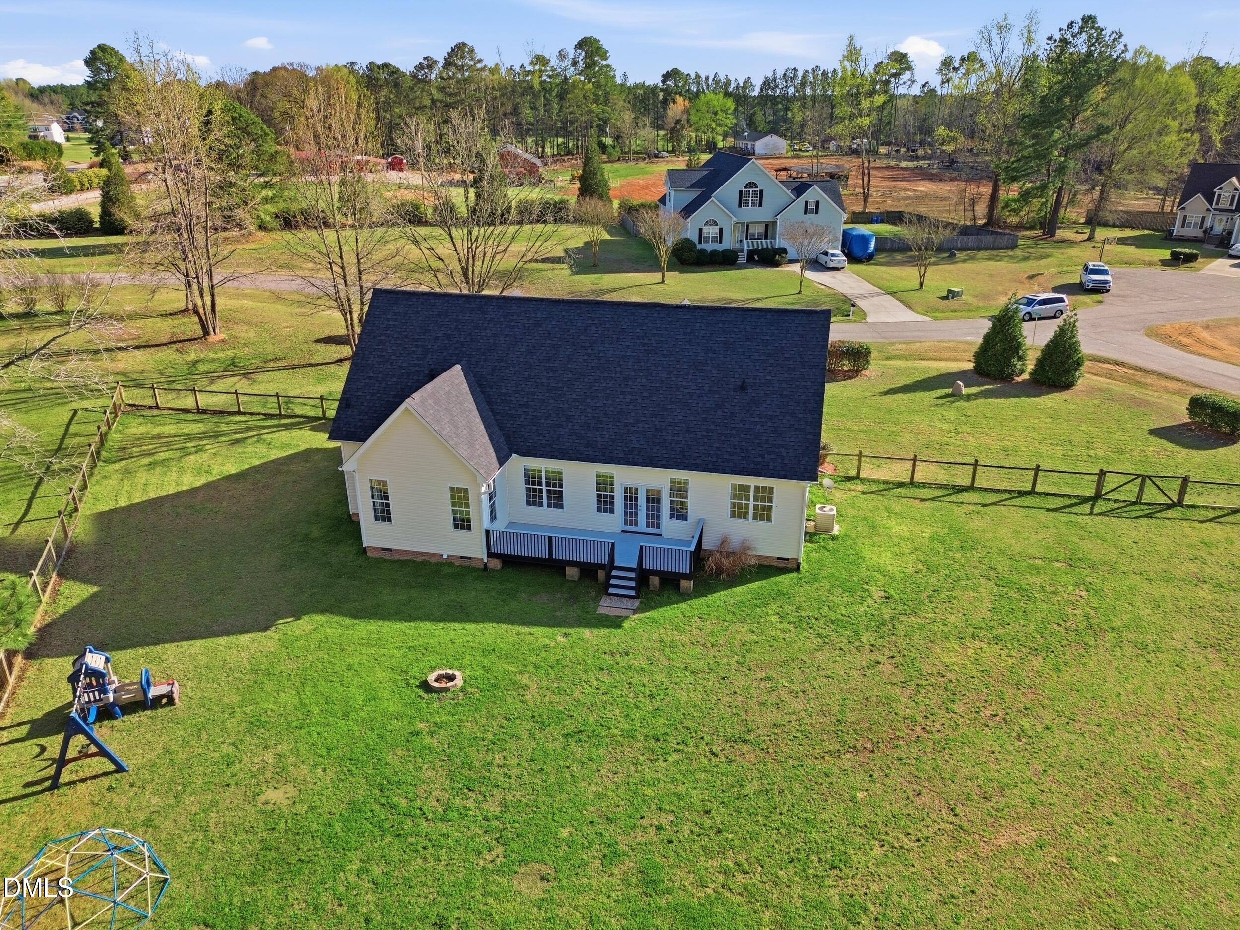 10 Kinderkamack Road Youngsville, NC 27596 - Photo 29 of 46 a aerial view of a house with pool big yard and large trees