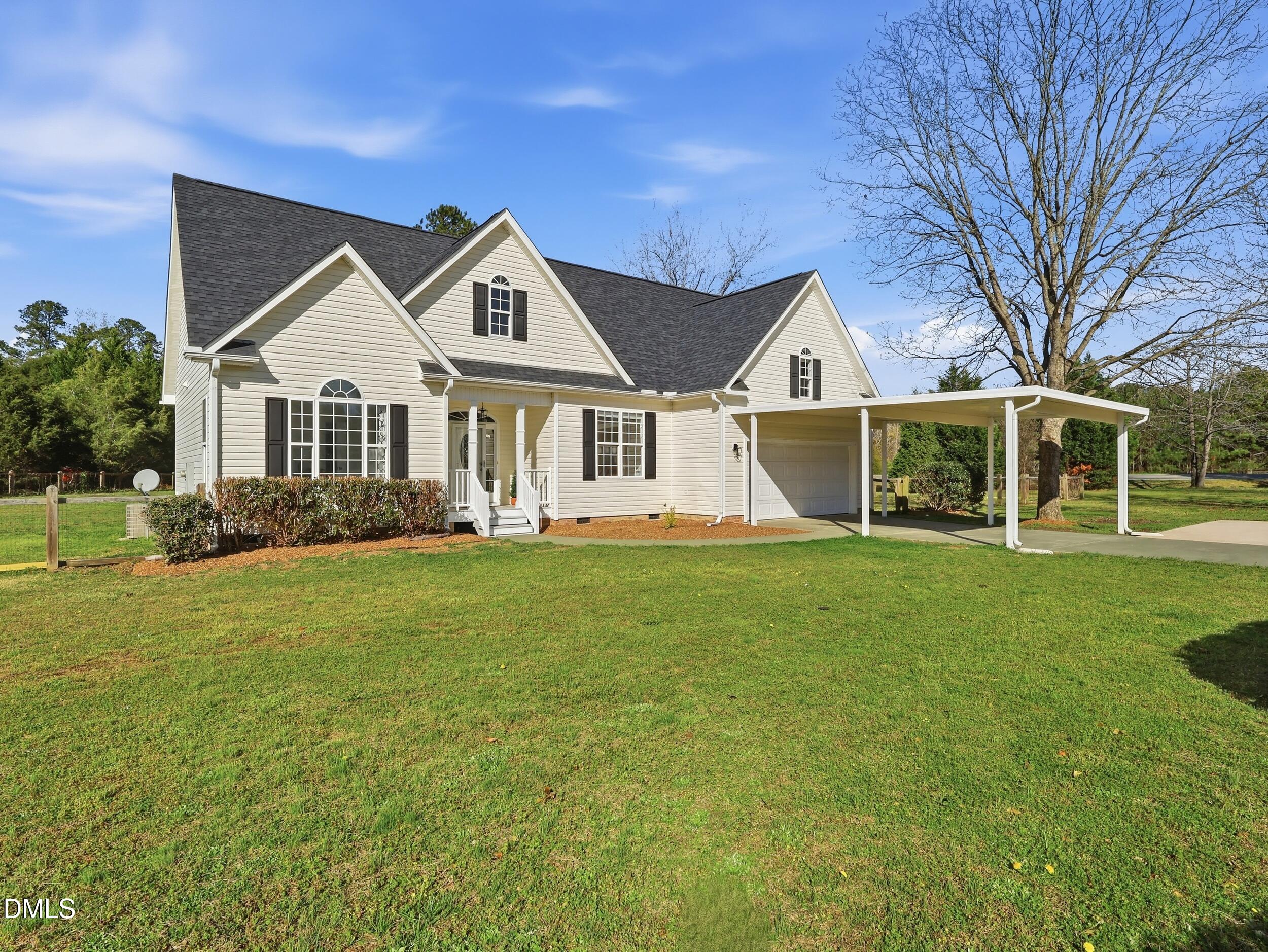 10 Kinderkamack Road Youngsville, NC 27596 - Photo 40 of 46 a front view of a house with a garden and trees