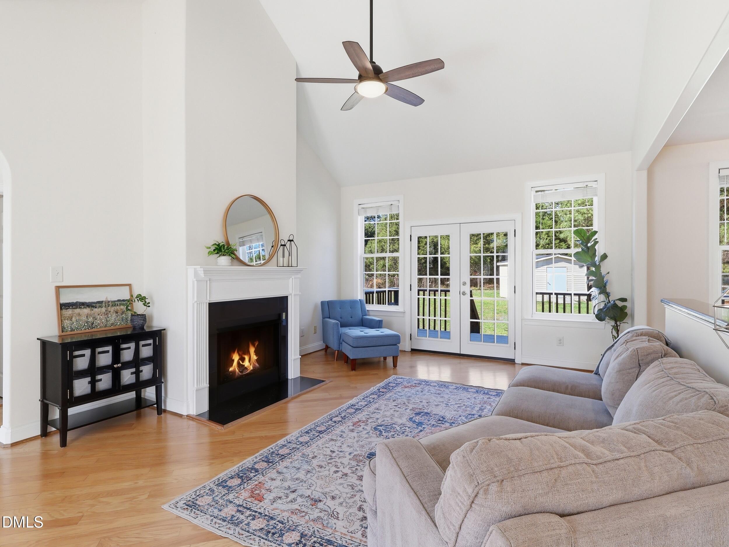 10 Kinderkamack Road Youngsville, NC 27596 - Photo 5 of 46 a living room with furniture a window and a fireplace