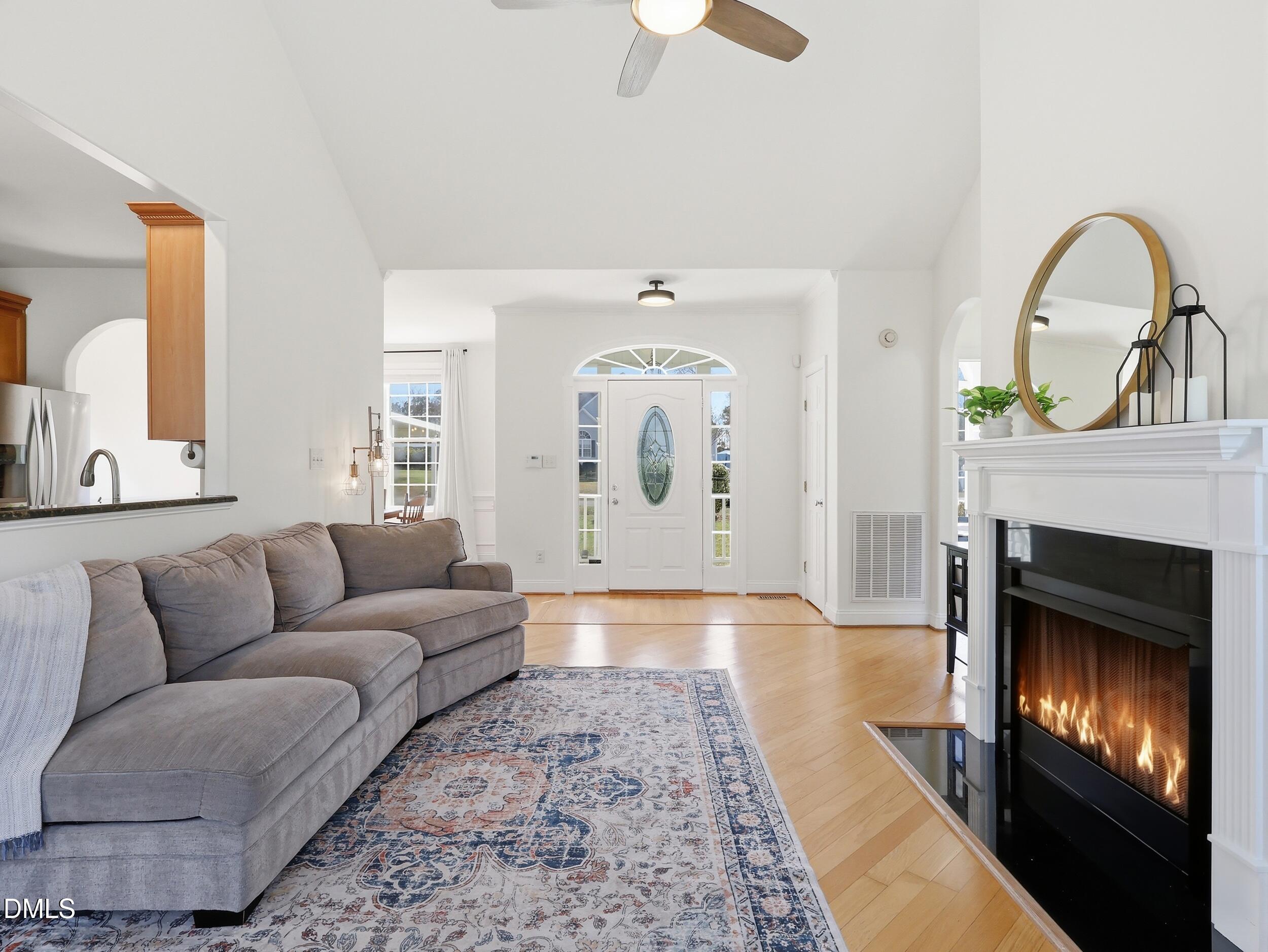 10 Kinderkamack Road Youngsville, NC 27596 - Photo 7 of 46 a living room with furniture a fireplace and window