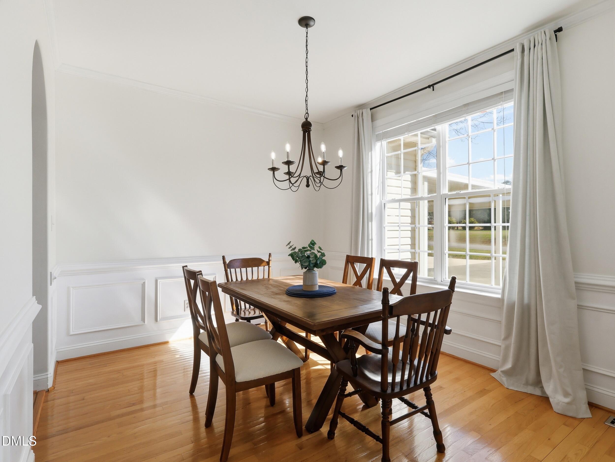 10 Kinderkamack Road Youngsville, NC 27596 - Photo 8 of 46 a view of a dining room with furniture window and wooden floor