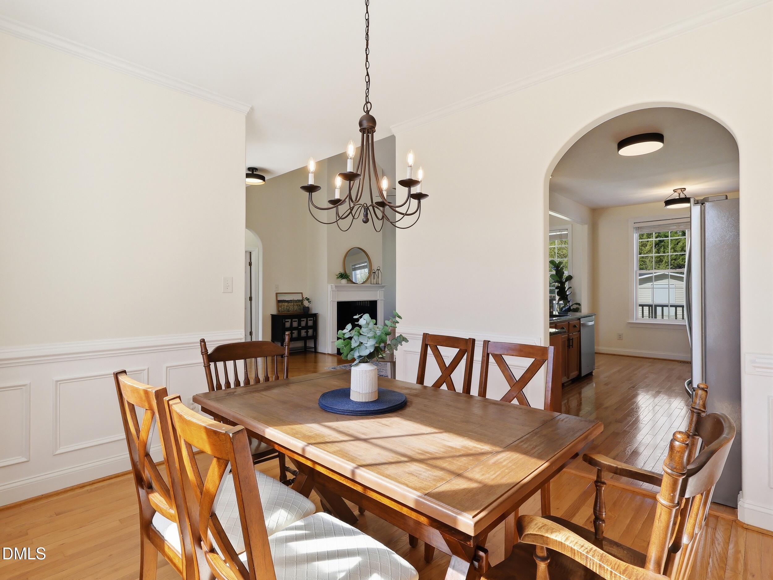 10 Kinderkamack Road Youngsville, NC 27596 - Photo 9 of 46 a view of a dining room with furniture and wooden floor