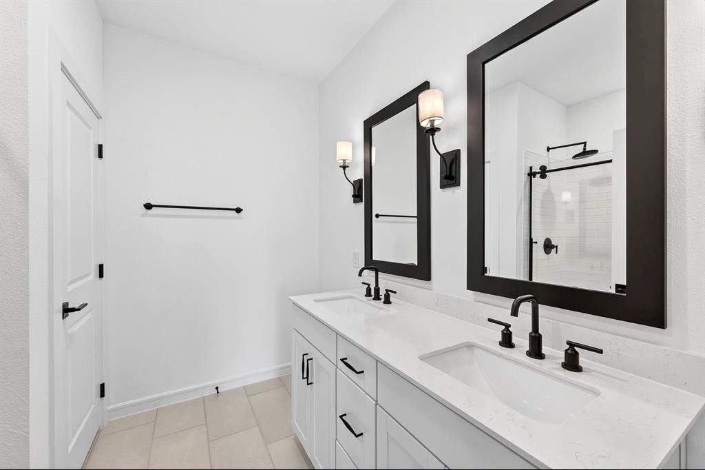 1313 Richardson Street Howe, TX 75459 - Photo 18 of 28 a bathroom with double vanity sink and two mirror