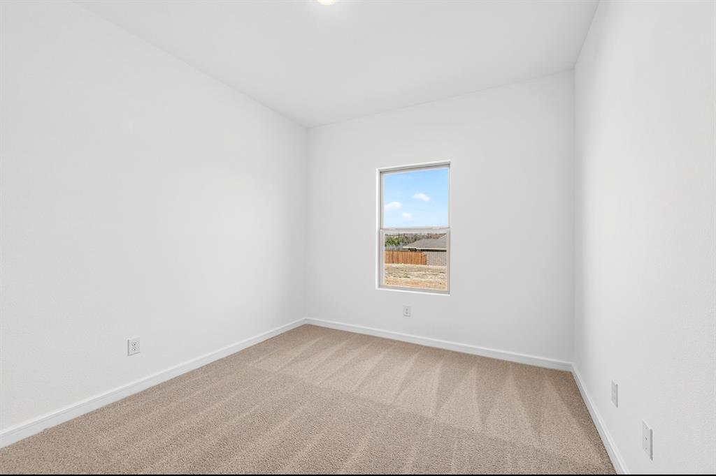 1313 Richardson Street Howe, TX 75459 - Photo 22 of 28 an empty room with a window