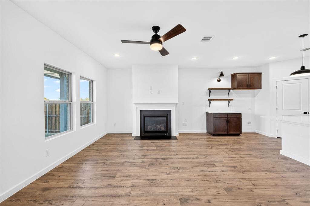 1313 Richardson Street Howe, TX 75459 - Photo 7 of 28 a view of a livingroom with a fireplace and window
