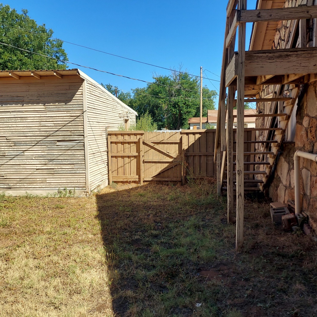 1608 Backus Street Paducah, TX 79248 - Photo 9 of 21 View of yard with a gate and stairway