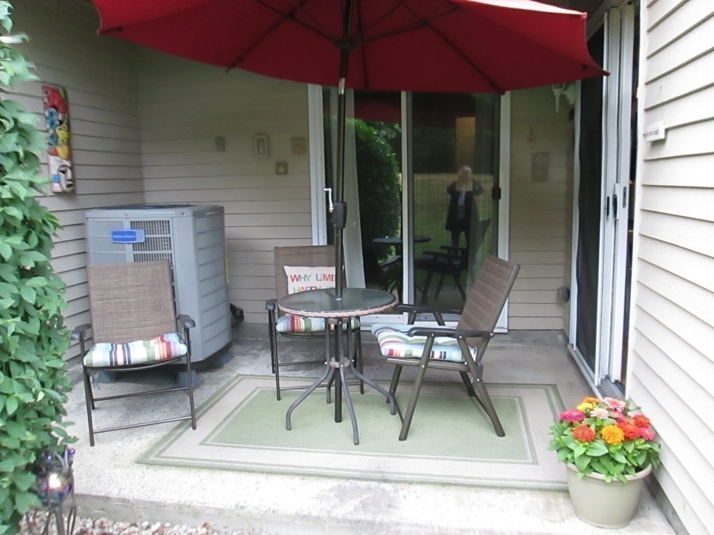 4 Duck Pond Road, Unit 204 Beverly, MA 01915 - Photo 17 of 23 a view of a house with a patio