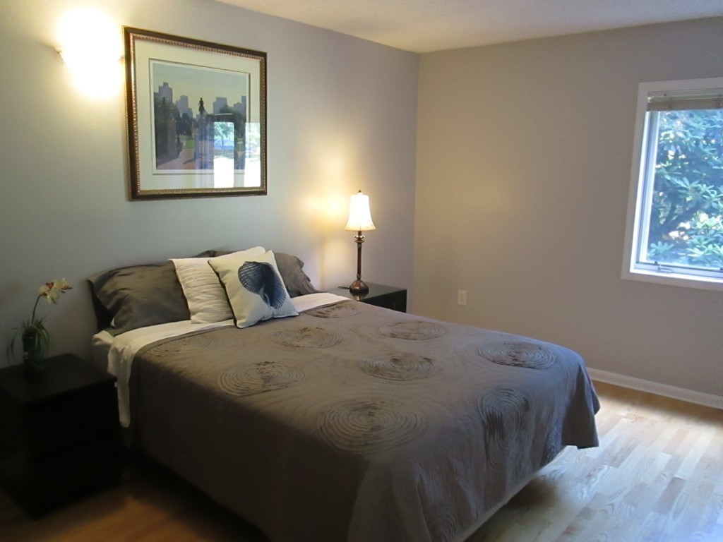 4 Duck Pond Road, Unit 204 Beverly, MA 01915 - Photo 20 of 23 a bedroom with a bed and a window