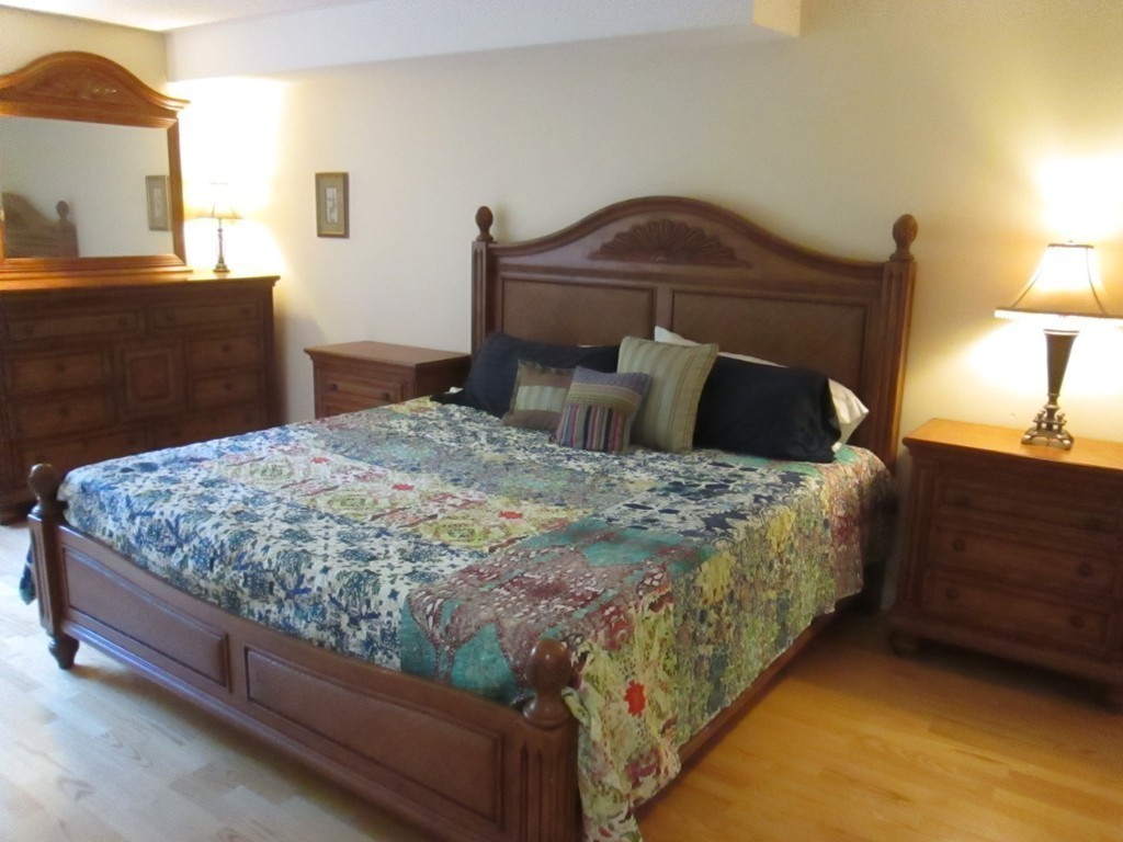 4 Duck Pond Road, Unit 204 Beverly, MA 01915 - Photo 21 of 23 a bedroom with a bed and lamps