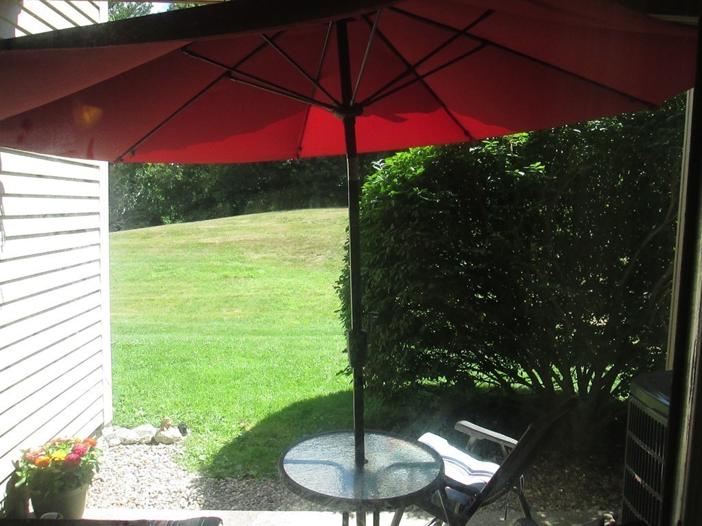 4 Duck Pond Road, Unit 204 Beverly, MA 01915 - Photo 23 of 23 a swimming pool with outdoor seating and yard