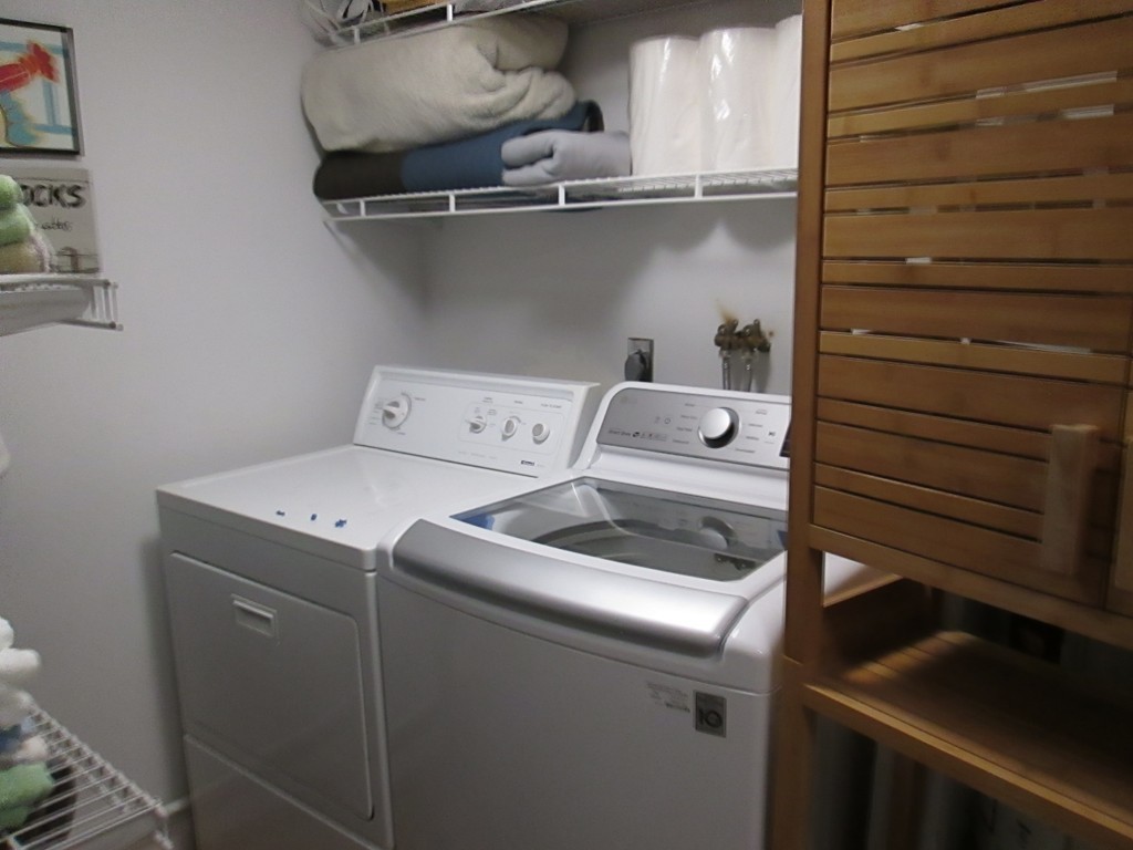 4 Duck Pond Road, Unit 204 Beverly, MA 01915 - Photo 6 of 23 a utility room with dryer washer and empty racks