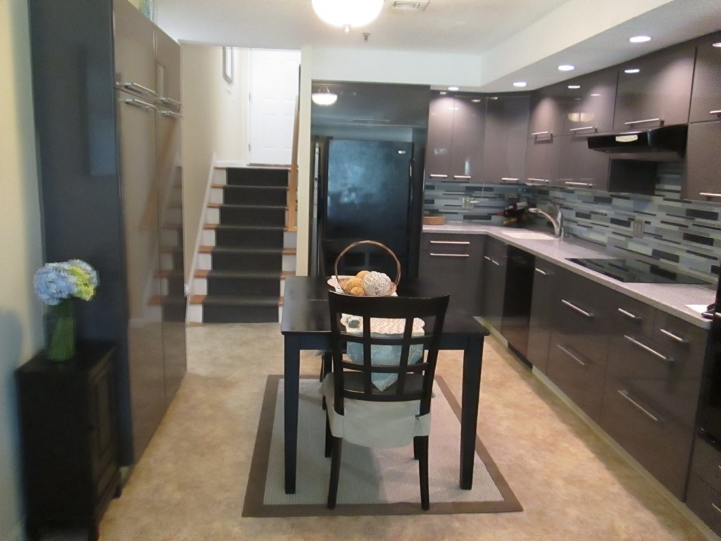 4 Duck Pond Road, Unit 204 Beverly, MA 01915 - Photo 8 of 23 a kitchen with stainless steel appliances granite countertop a stove a sink and a refrigerator