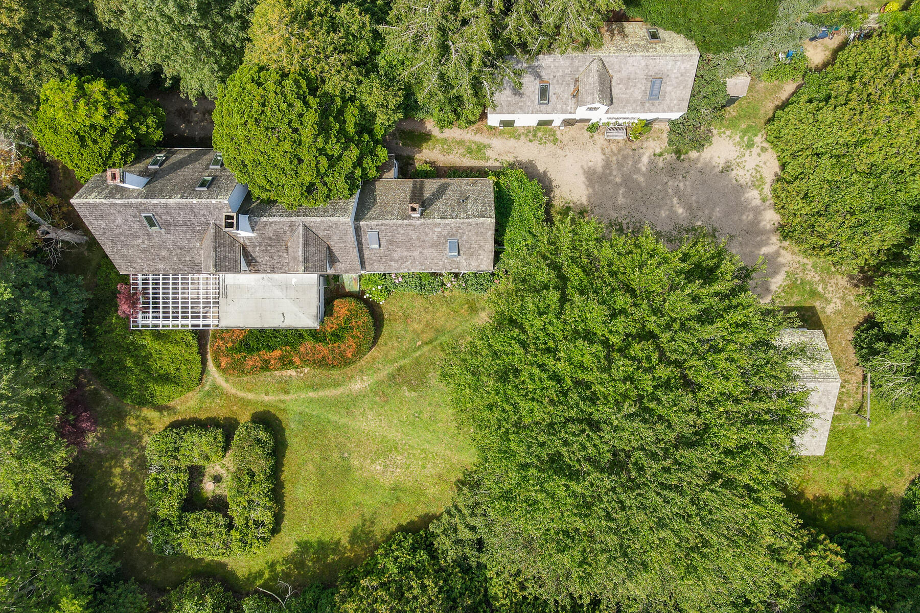 118 Old Stage Road Centerville, MA 02632 - Photo 1 of 41 an aerial view of a house with swimming pool and garden view