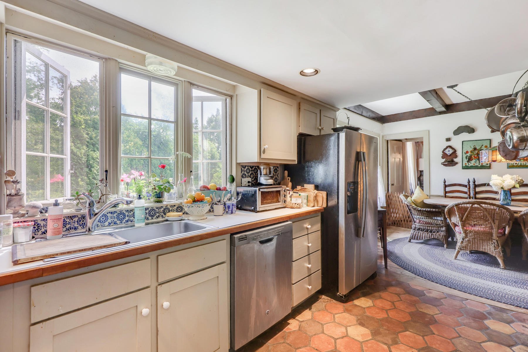 118 Old Stage Road Centerville, MA 02632 - Photo 16 of 41 a kitchen with sink refrigerator and window
