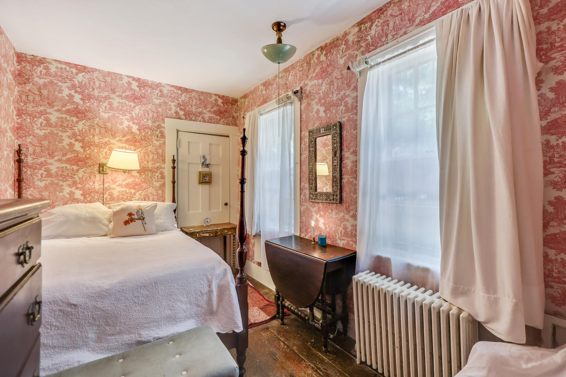 118 Old Stage Road Centerville, MA 02632 - Photo 17 of 41 a bedroom with a bed and a chandelier