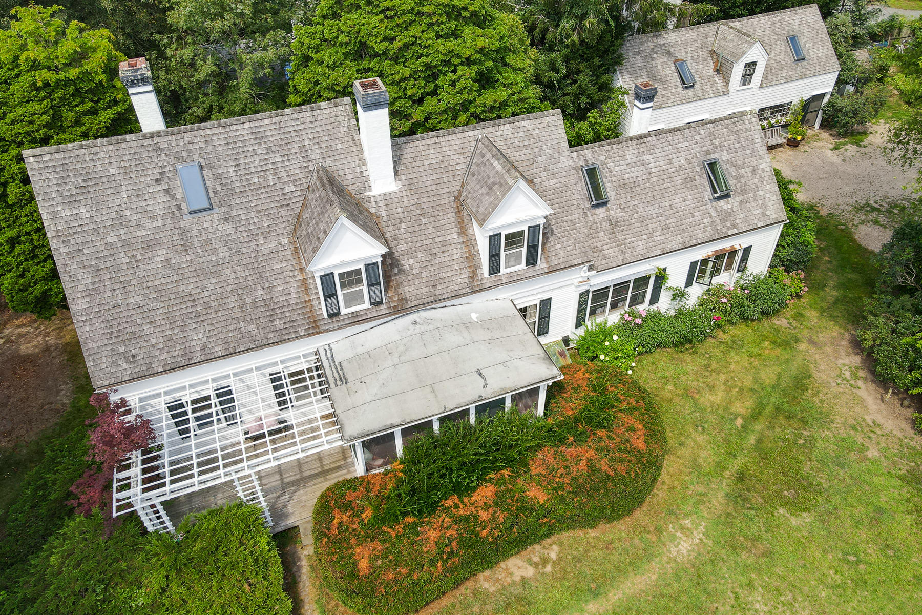 118 Old Stage Road Centerville, MA 02632 - Photo 2 of 41 an aerial view of a house with a yard and potted plants