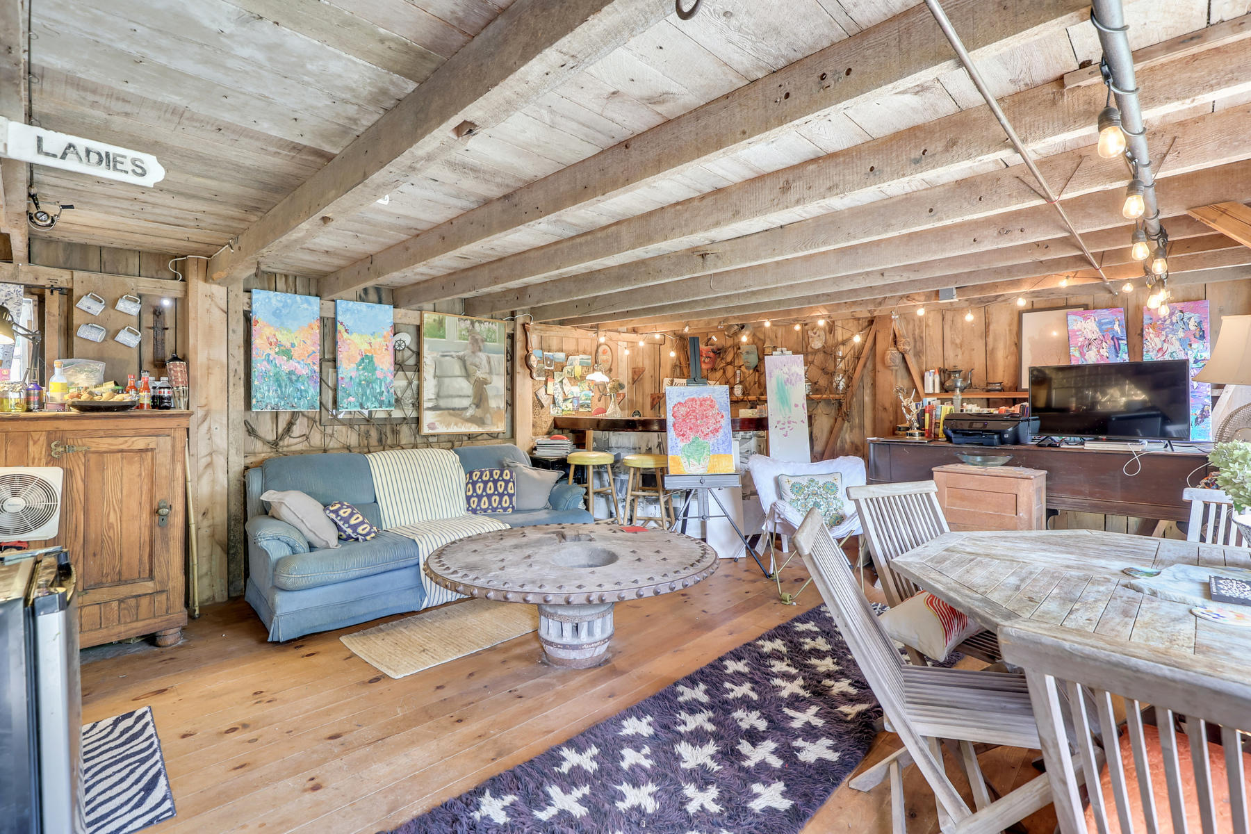 118 Old Stage Road Centerville, MA 02632 - Photo 24 of 41 a living room with furniture and a flat screen tv