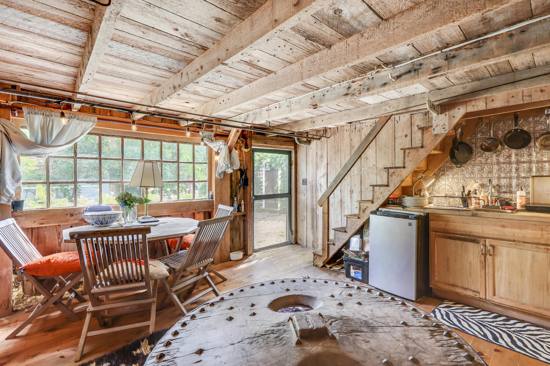 118 Old Stage Road Centerville, MA 02632 - Photo 26 of 41 a view of a livingroom with furniture wooden floor and windows
