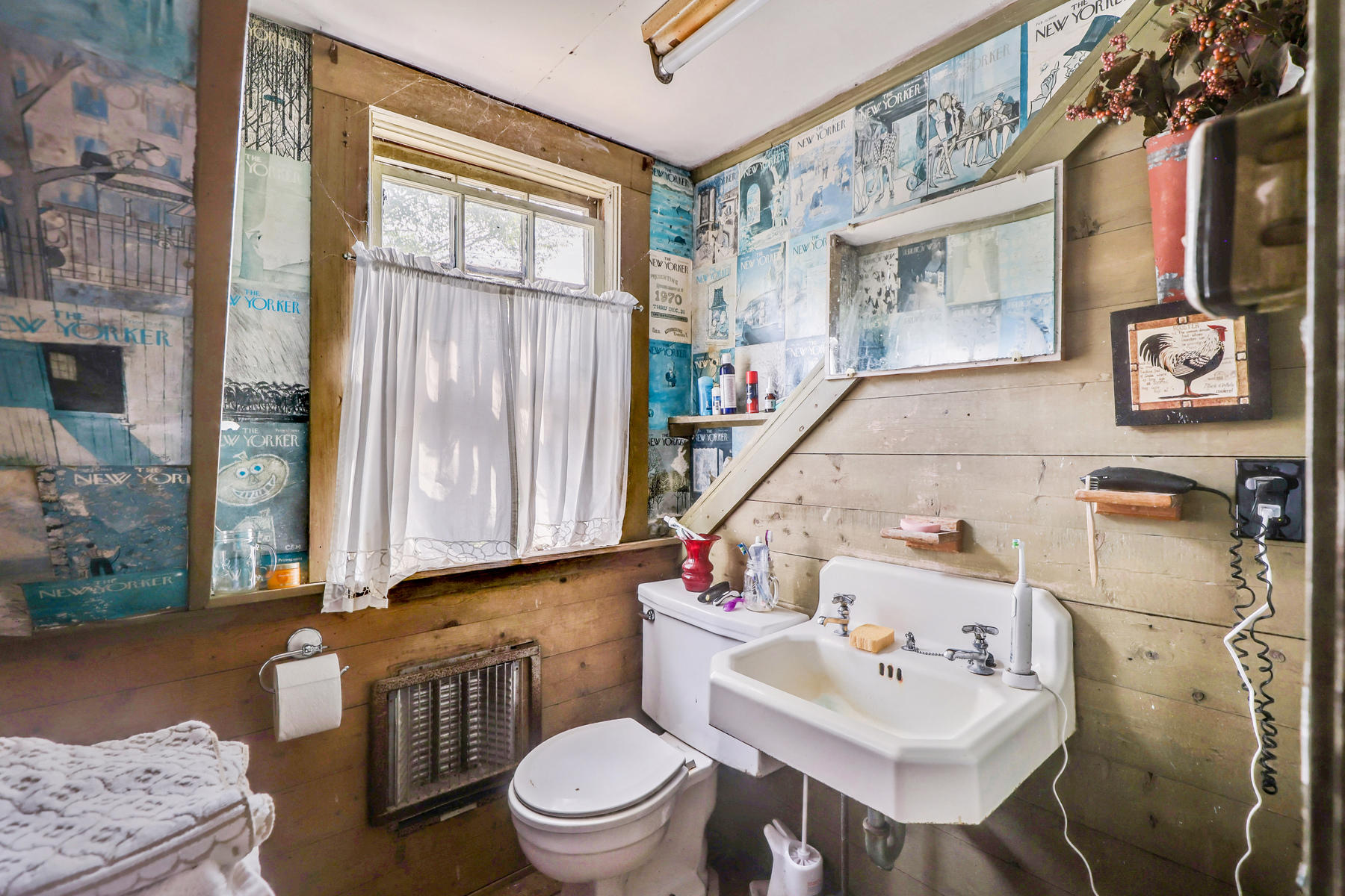 118 Old Stage Road Centerville, MA 02632 - Photo 27 of 41 a white toilet sitting next to a bathroom sink