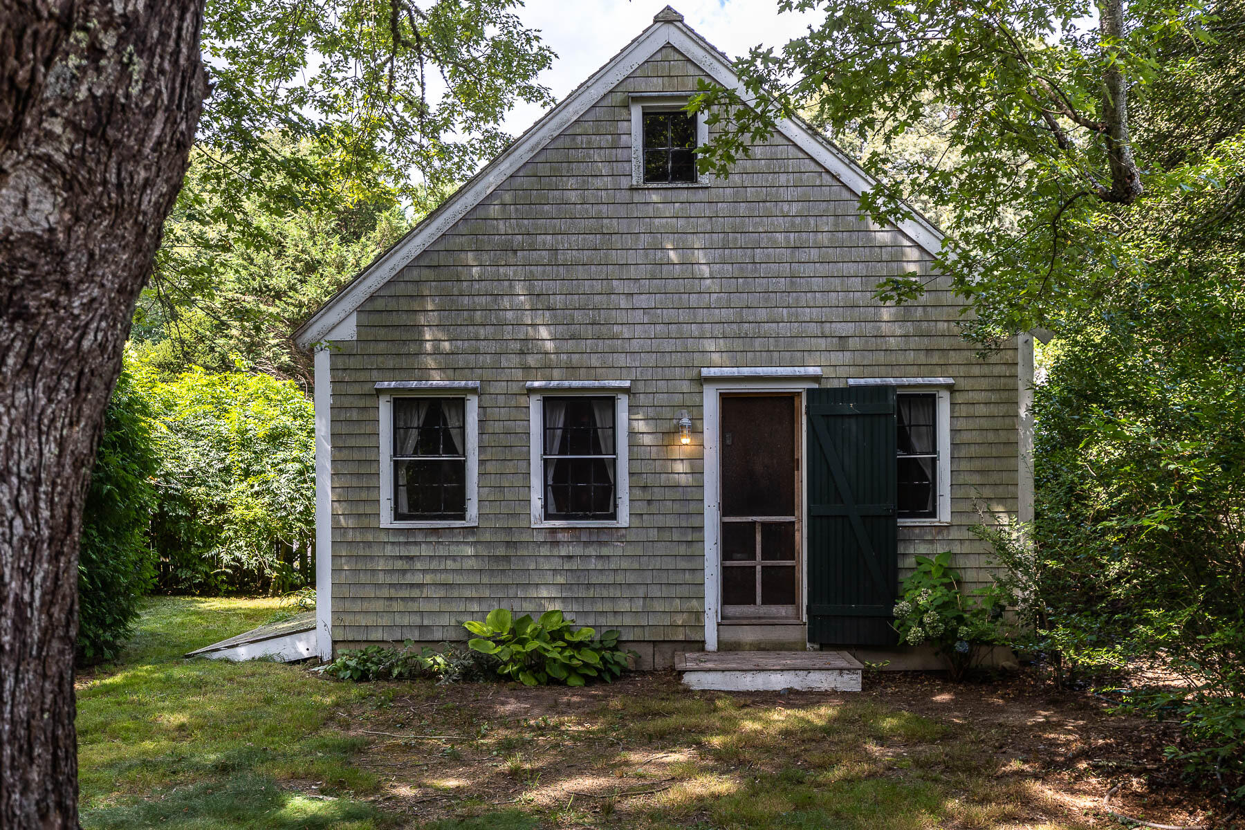 118 Old Stage Road Centerville, MA 02632 - Photo 29 of 41 a front view of a house with garden