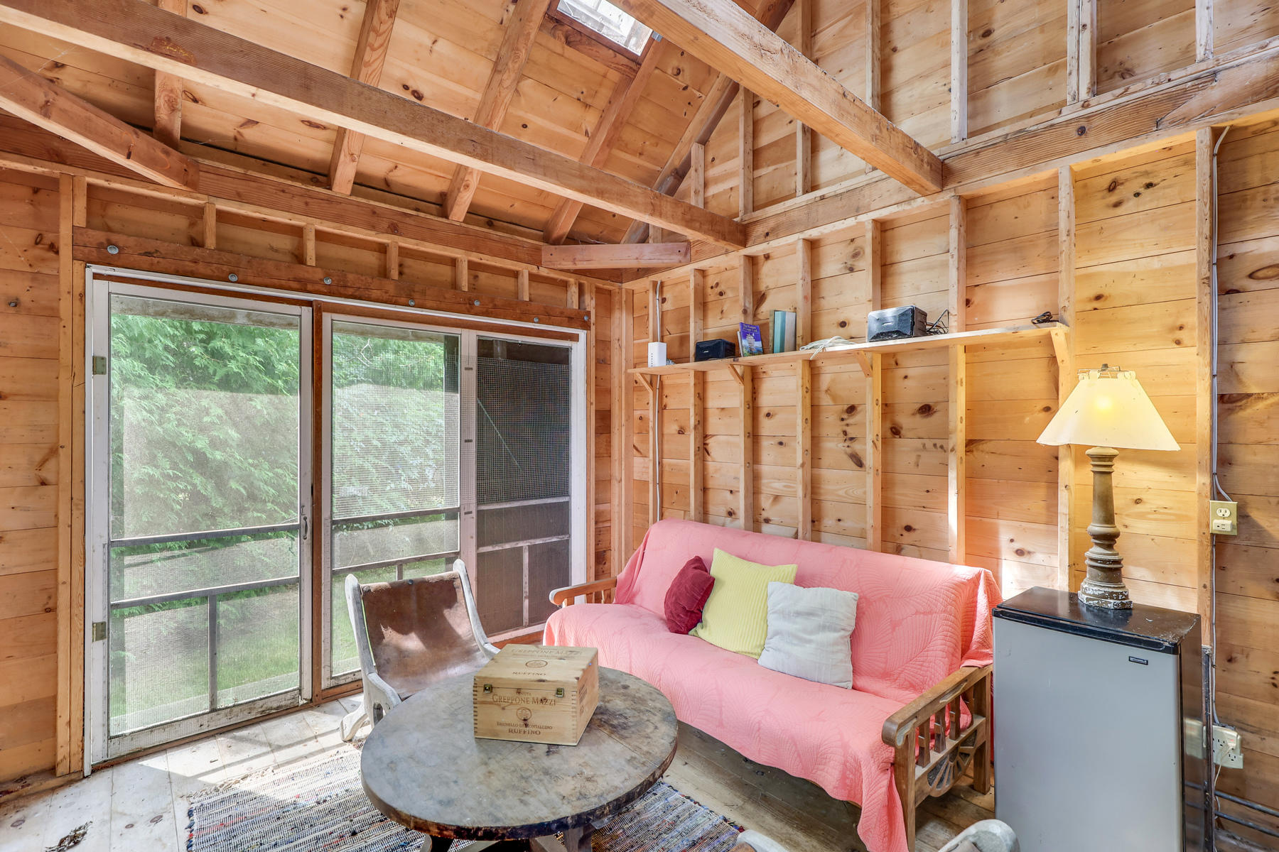 118 Old Stage Road Centerville, MA 02632 - Photo 31 of 41 a living room with furniture and a floor to ceiling window