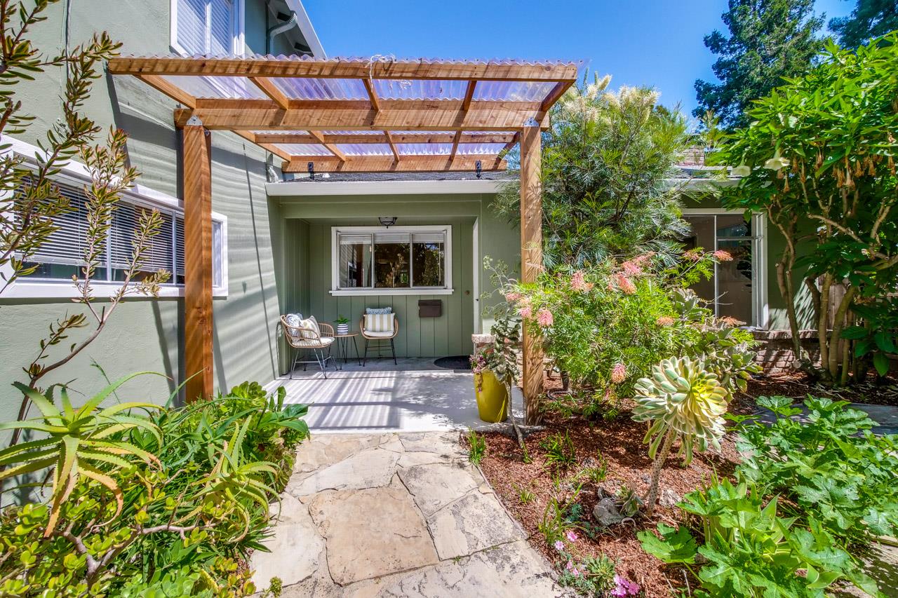 1640 Mercy Street Mountain View, CA 94041 - Photo 4 of 5 a view of a house with potted plants and a bench