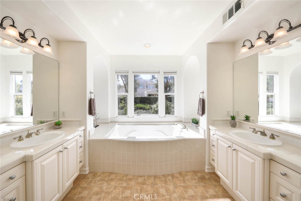 10 Cavaillon Newport Coast, CA 92657 - Photo 20 of 47 a bathroom with a large tub sink and double vanity