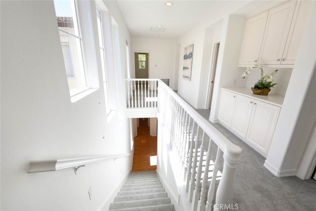 10 Cavaillon Newport Coast, CA 92657 - Photo 31 of 47 a view of a hallway with wooden floor and staircase