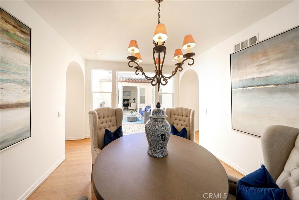 10 Cavaillon Newport Coast, CA 92657 - Photo 34 of 47 a view of a dining room with furniture and a chandelier