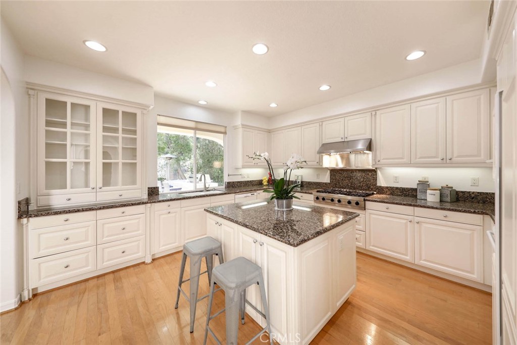 10 Cavaillon Newport Coast, CA 92657 - Photo 35 of 47 a kitchen with granite countertop a sink and white cabinets