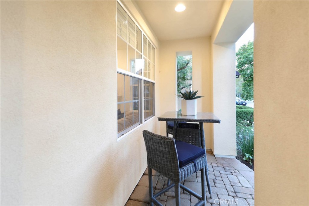 10 Cavaillon Newport Coast, CA 92657 - Photo 37 of 47 a dining room with furniture and wooden floor