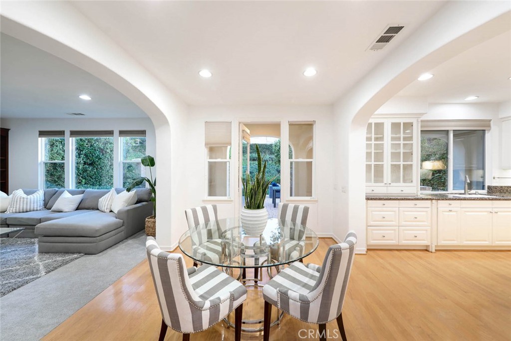 10 Cavaillon Newport Coast, CA 92657 - Photo 39 of 47 a view of a dining room with furniture large windows and wooden floor