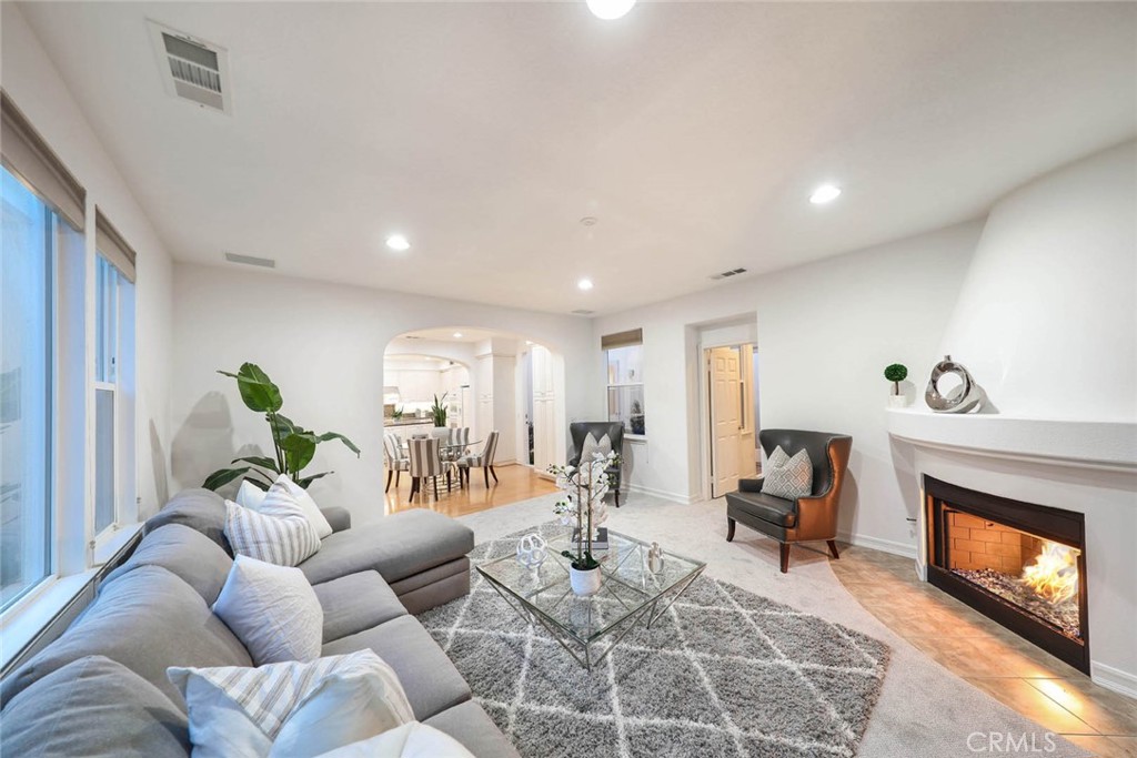 10 Cavaillon Newport Coast, CA 92657 - Photo 47 of 47 a living room with furniture a fireplace and a flat screen tv