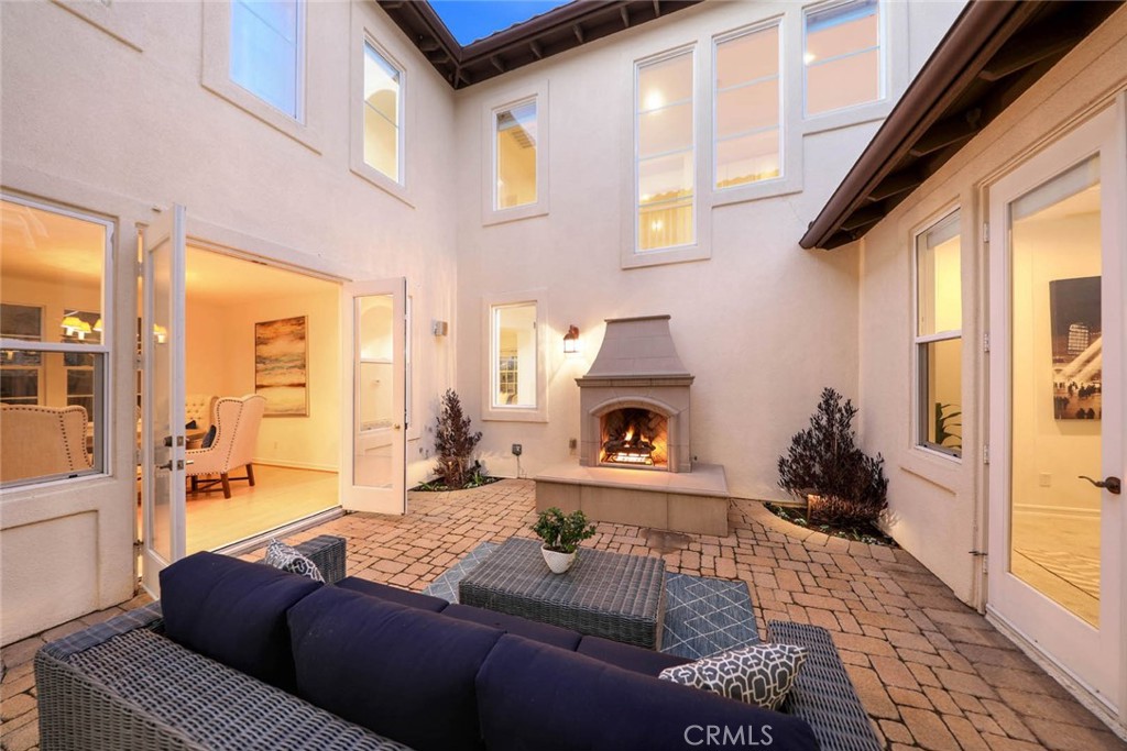 10 Cavaillon Newport Coast, CA 92657 - Photo 5 of 47 a living room with furniture and a fireplace