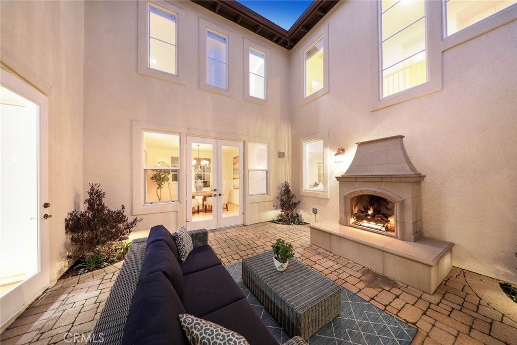 10 Cavaillon Newport Coast, CA 92657 - Photo 6 of 47 a living room with furniture and a fireplace