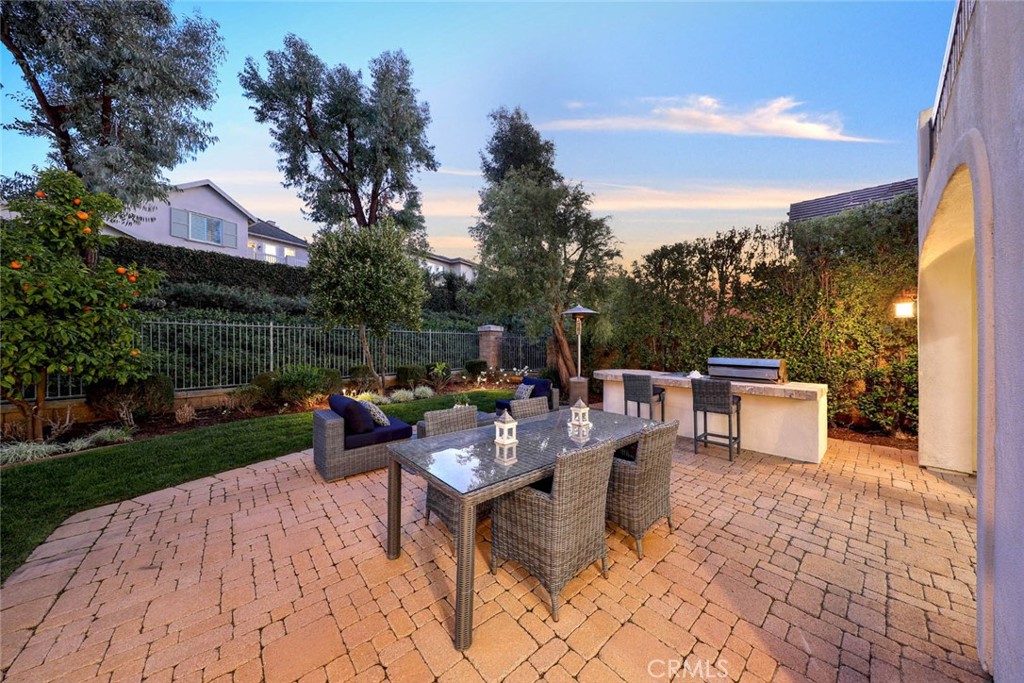 10 Cavaillon Newport Coast, CA 92657 - Photo 7 of 47 a backyard of a house with table and chairs