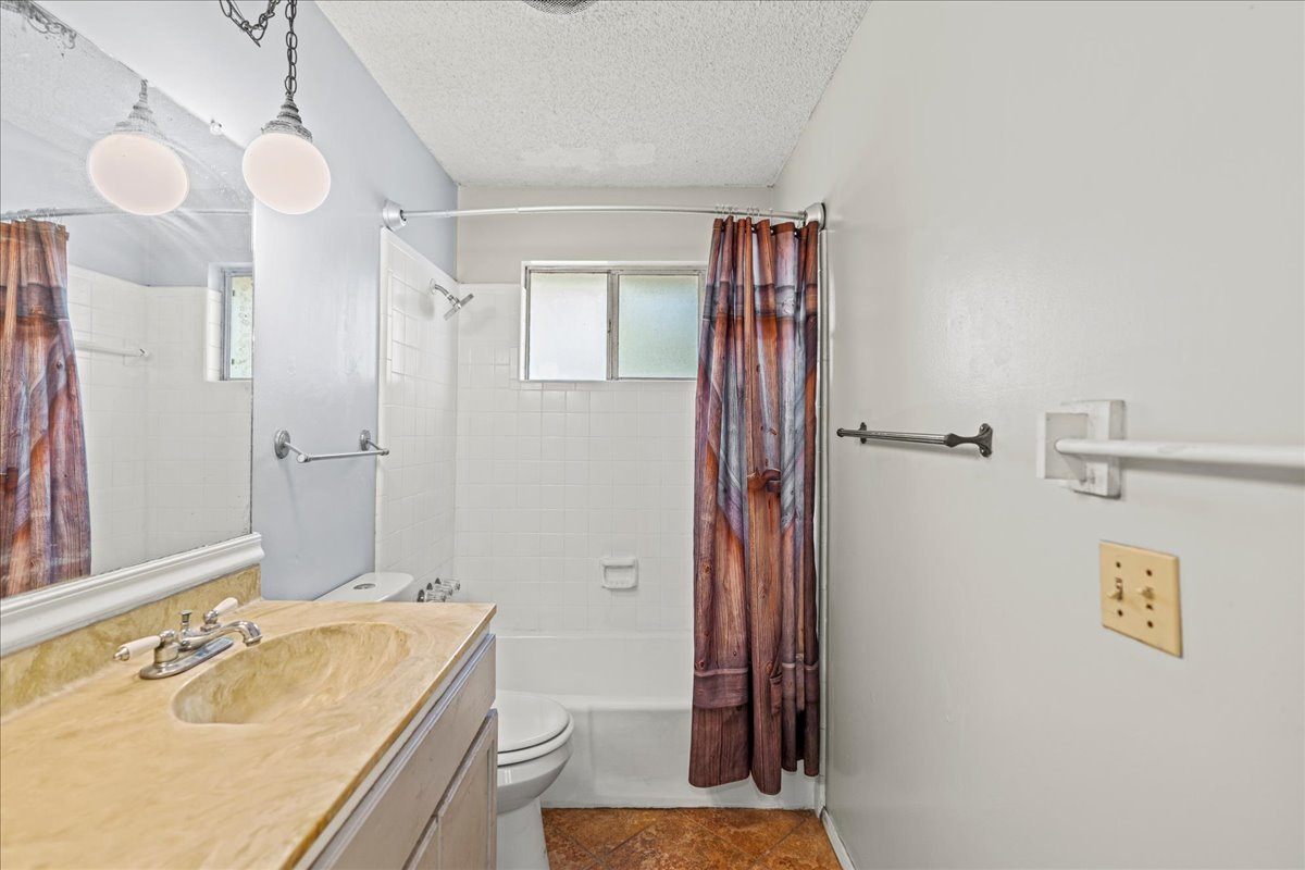 5403 Valencia Court Georgetown, TX 78628 - Photo 13 of 34 a bathroom with a sink a toilet and shower