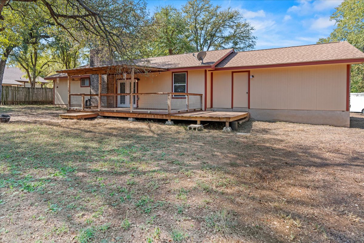 5403 Valencia Court Georgetown, TX 78628 - Photo 20 of 34 a backyard of a house with yard and garage