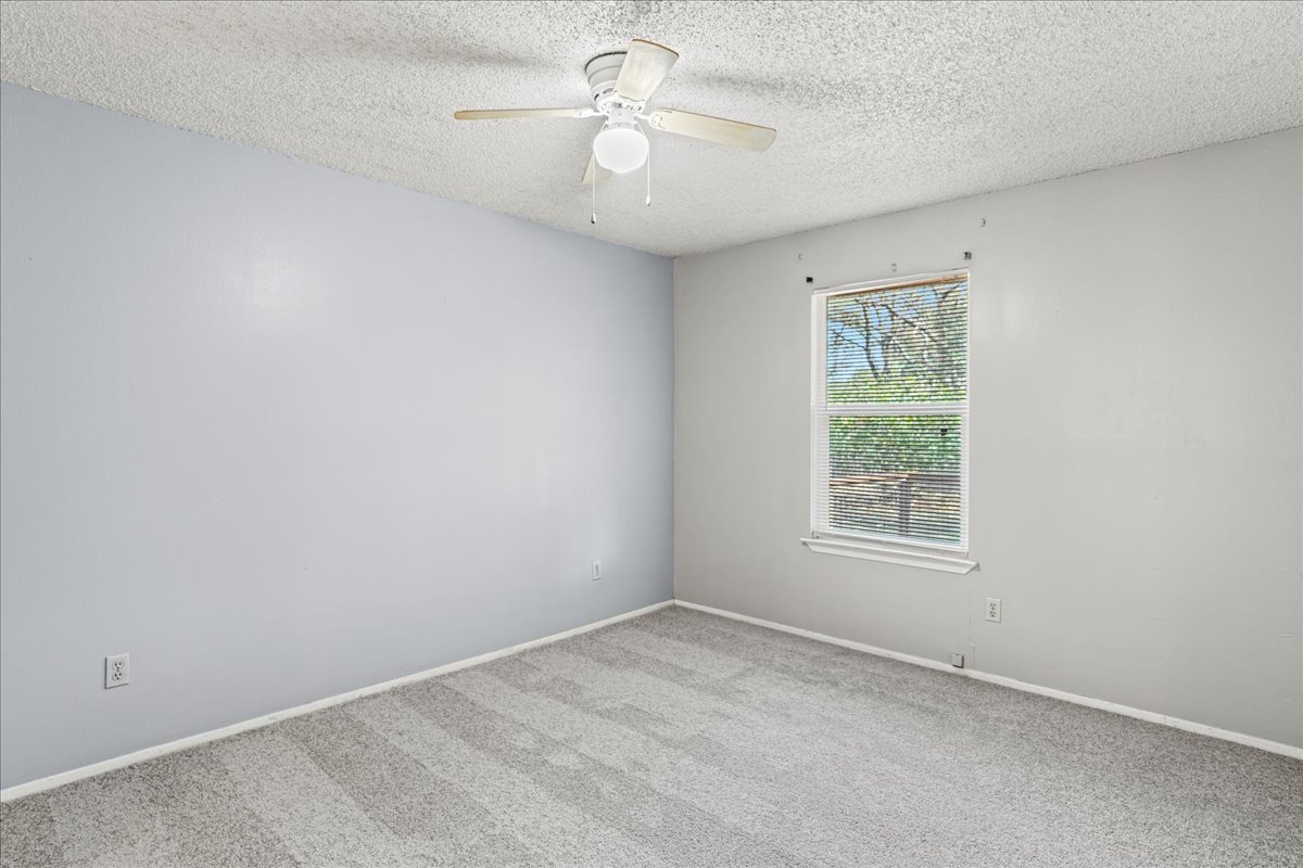 5403 Valencia Court Georgetown, TX 78628 - Photo 28 of 34 an empty room with a window and a fan