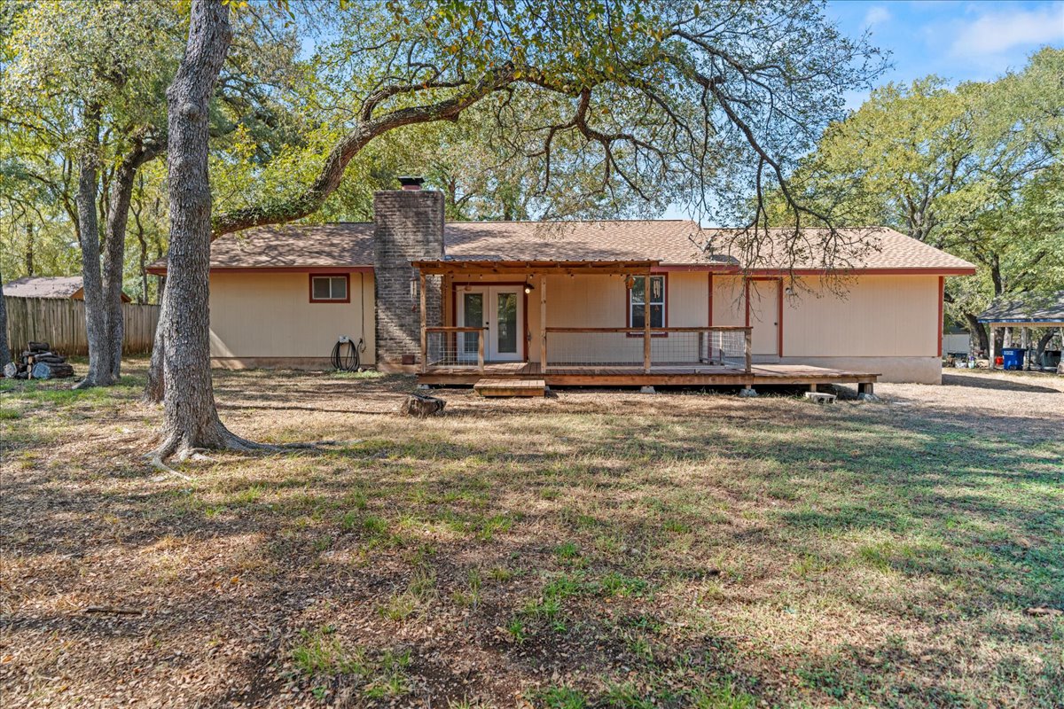 5403 Valencia Court Georgetown, TX 78628 - Photo 33 of 34 a front view of house with yard and trees in the background