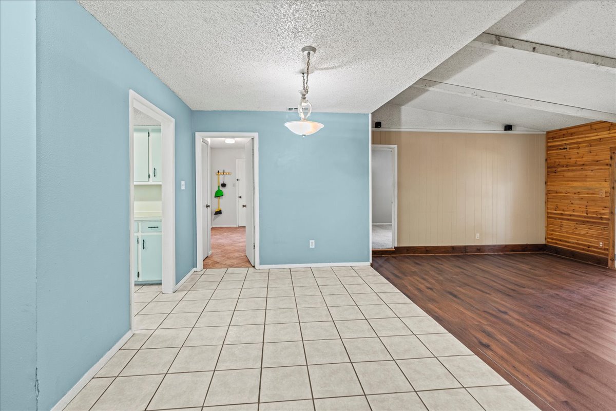 5403 Valencia Court Georgetown, TX 78628 - Photo 6 of 34 an empty room with wooden floor and windows