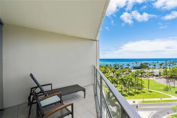 a view of a balcony with an outdoor seating