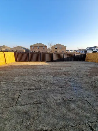 a view of a swimming pool with an outdoor space and seating area