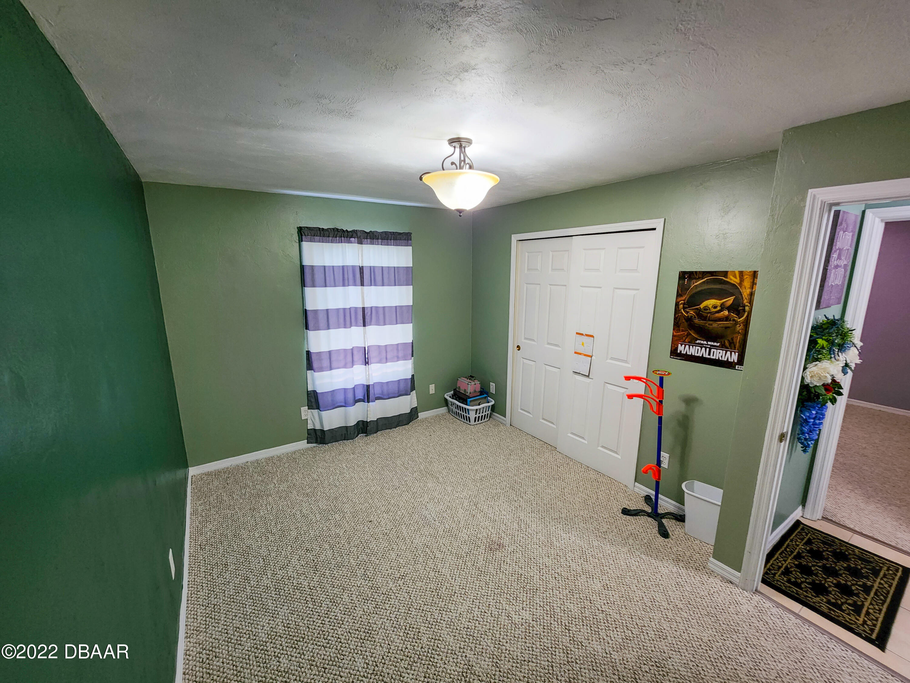 1467 Bay Grove Drive Port Orange, FL 32129 - Photo 17 of 35 a view of a room with gym equipment