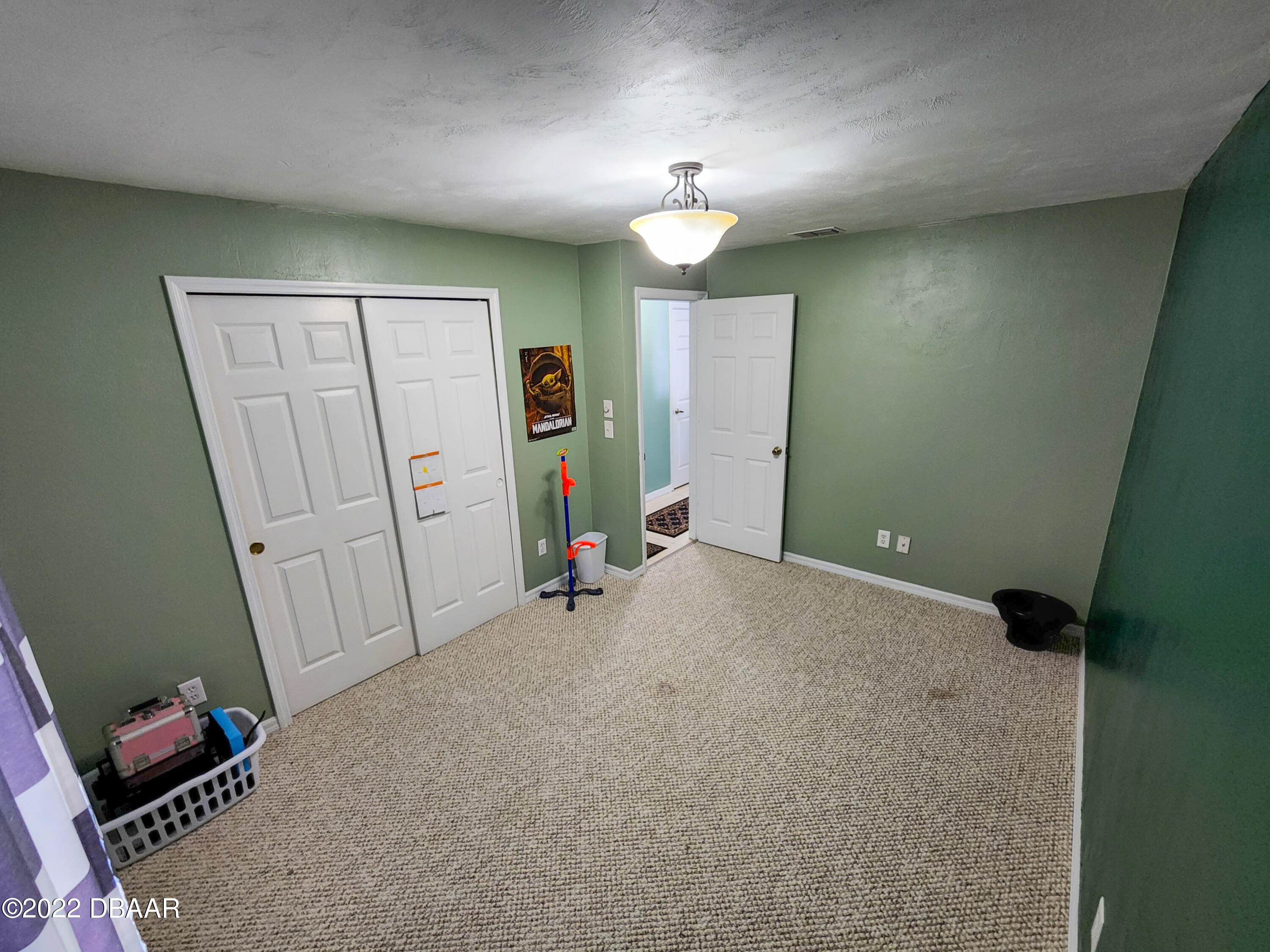1467 Bay Grove Drive Port Orange, FL 32129 - Photo 18 of 35 a view of a room with furniture and storage