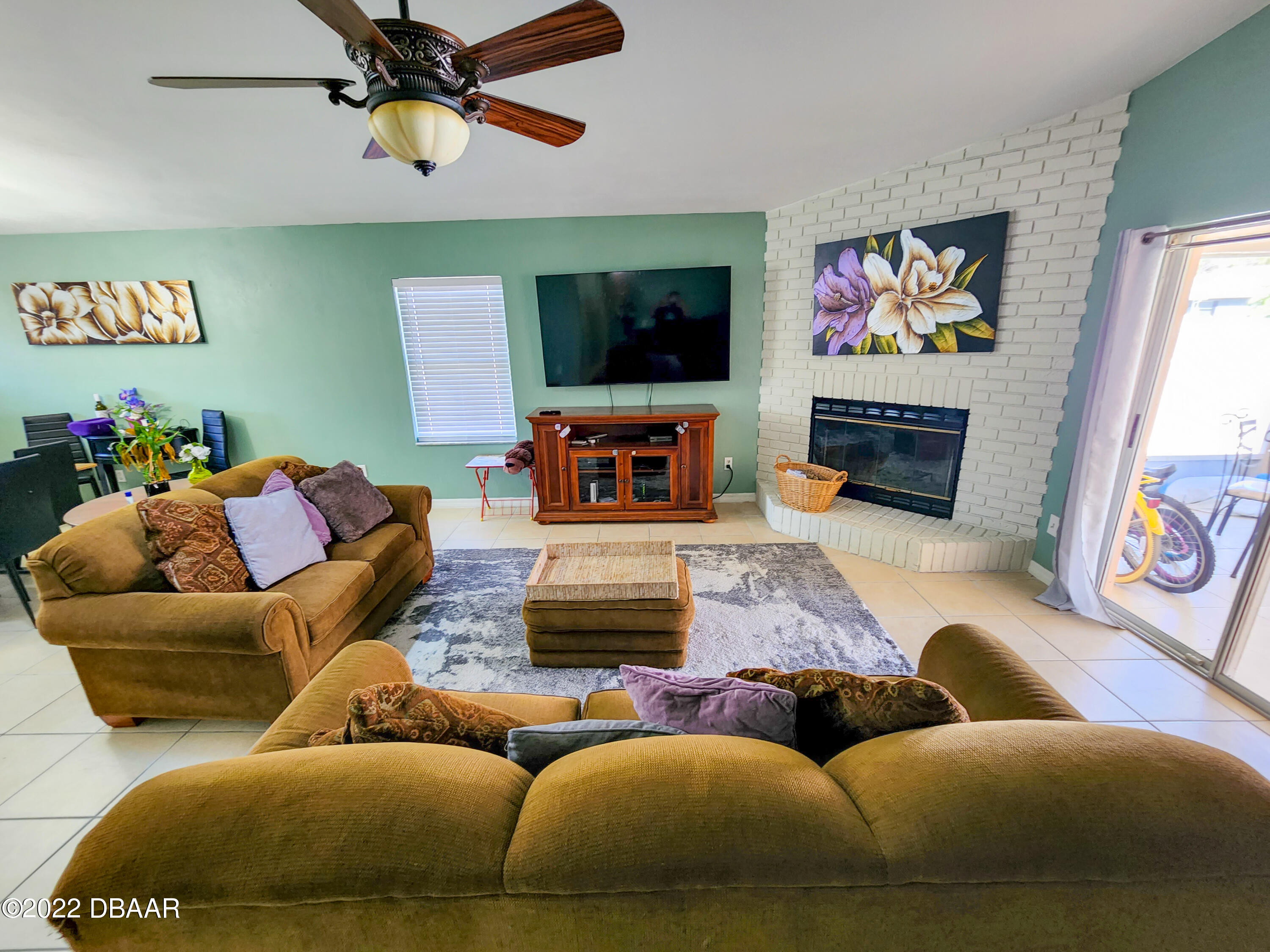 1467 Bay Grove Drive Port Orange, FL 32129 - Photo 19 of 35 a living room with furniture and a flat screen tv
