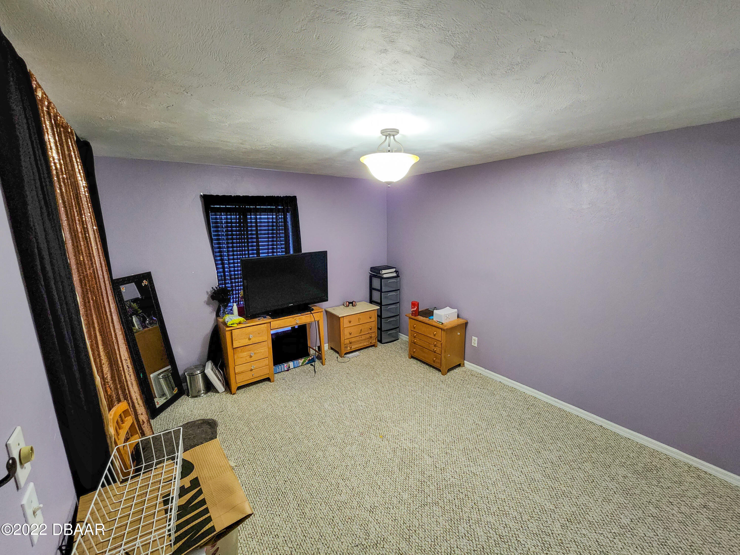 1467 Bay Grove Drive Port Orange, FL 32129 - Photo 20 of 35 a living room with furniture and a flat screen tv