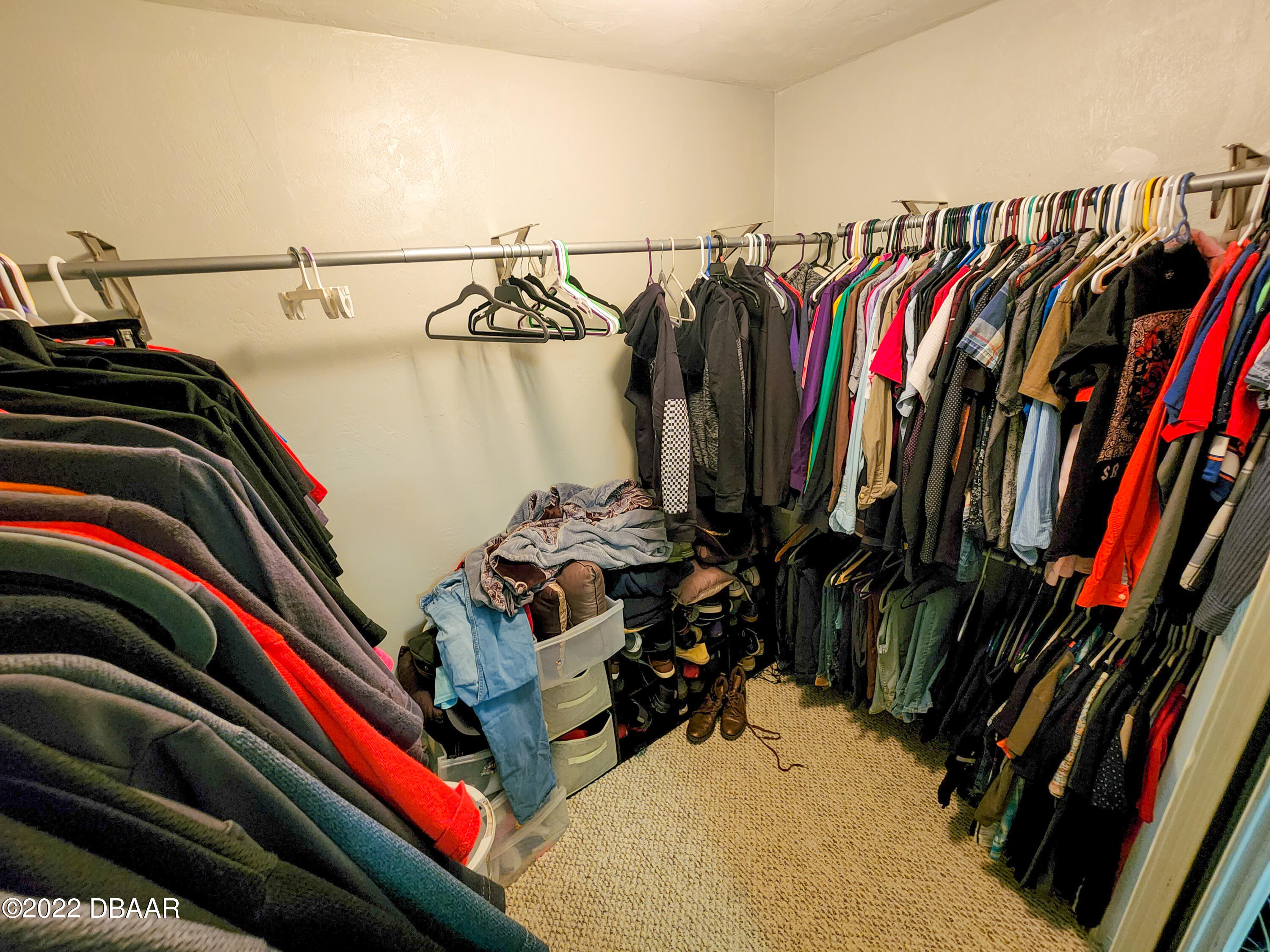 1467 Bay Grove Drive Port Orange, FL 32129 - Photo 27 of 35 a view of walk in closet with clothes and shoes