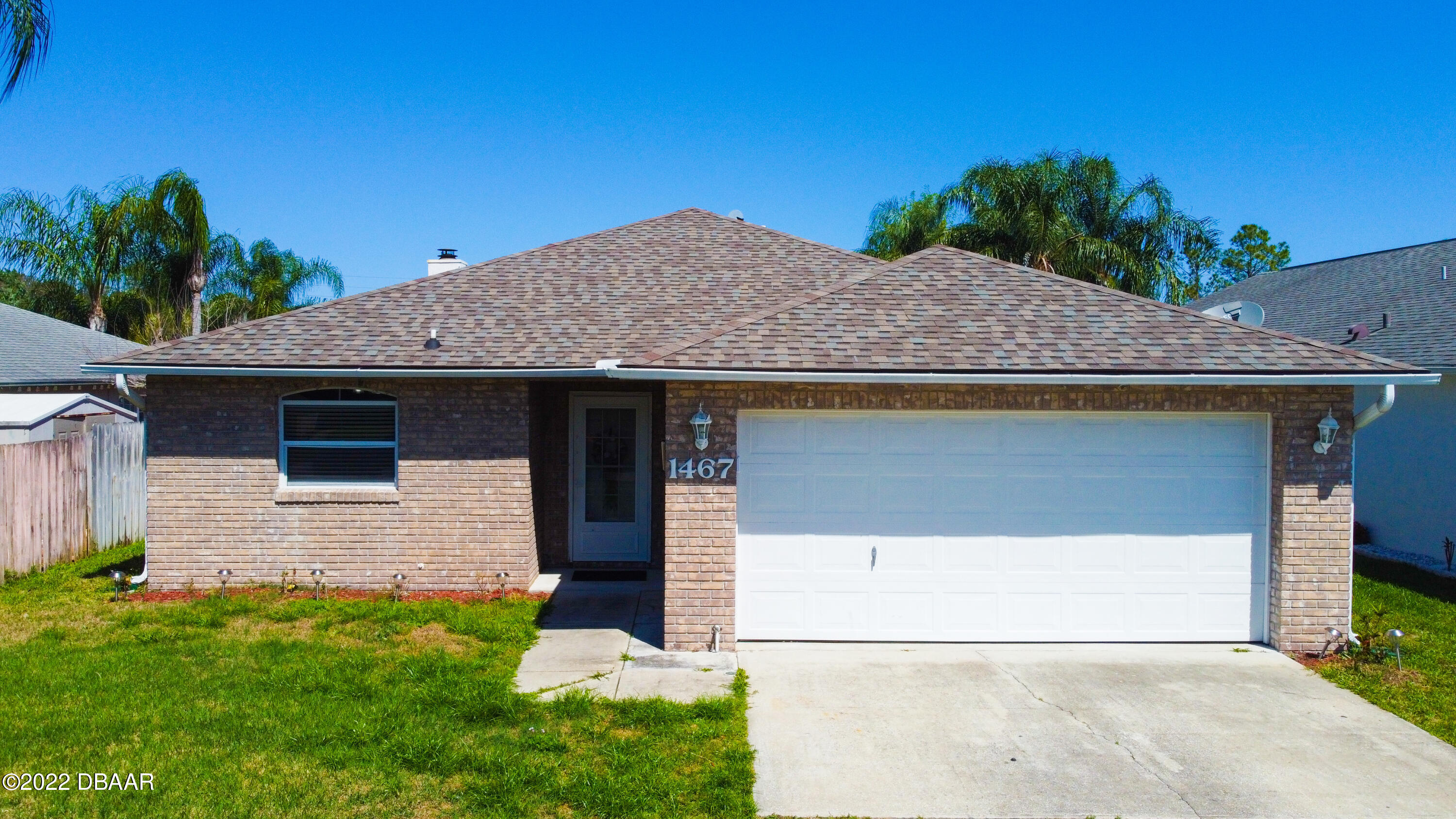 1467 Bay Grove Drive Port Orange, FL 32129 - Photo 29 of 35 a front view of a house with garden